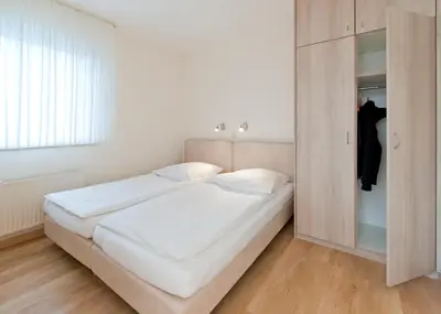 Ein Bett oder Betten in einem Zimmer der Unterkunft Haus Seemuschel - Fewo 1