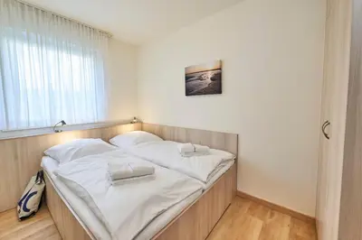Ein Bett oder Betten in einem Zimmer der Unterkunft Haus Seemuschel - Fewo 3