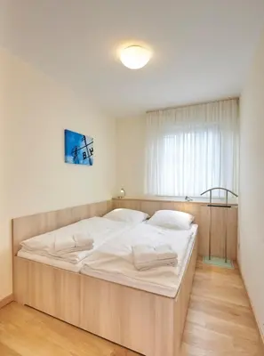 Ein Bett oder Betten in einem Zimmer der Unterkunft Haus Seemuschel - Fewo 8