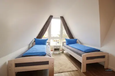 Ein Bett oder Betten in einem Zimmer der Unterkunft Landhaus Rosenhof Whg. 4