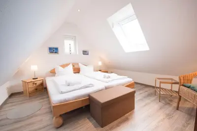 Ein Bett oder Betten in einem Zimmer der Unterkunft Ferienwohnung 'Möwe Whg. 4'