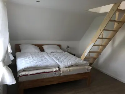 Ein Bett oder Betten in einem Zimmer der Unterkunft Ferienhaus Nordseerobbe