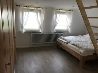 Ein Bett oder Betten in einem Zimmer der Unterkunft Ferienhaus Nordseerobbe