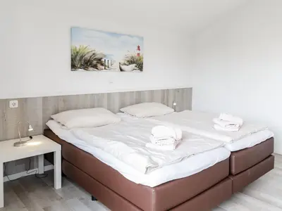 Ein Bett oder Betten in einem Zimmer der Unterkunft Haus Leo