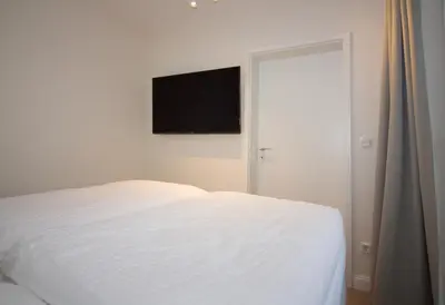 Ein Bett oder Betten in einem Zimmer der Unterkunft Kurpark-Residenz W112