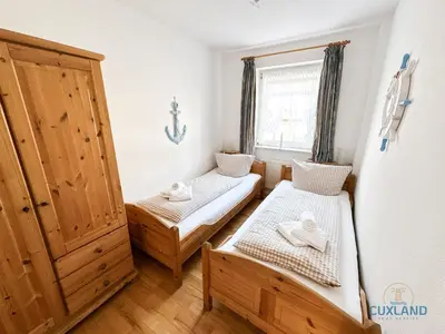 Ein Bett oder Betten in einem Zimmer der Unterkunft Haus Seeland 1 Whg. 13