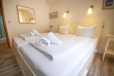 Ein Bett oder Betten in einem Zimmer der Unterkunft Nige Ooge 2