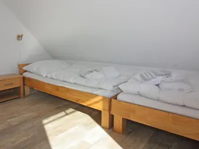 Ein Bett oder Betten in einem Zimmer der Unterkunft Komfortables Ferienhaus in Friedrichskoog-Spitze