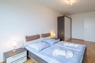 Ein Bett oder Betten in einem Zimmer der Unterkunft Residenz am Yachthafen Wohnung 5
