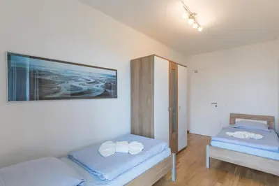Ein Bett oder Betten in einem Zimmer der Unterkunft Residenz am Yachthafen Wohnung 5