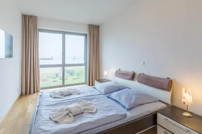 Ein Bett oder Betten in einem Zimmer der Unterkunft Residenz am Yachthafen Wohnung 5