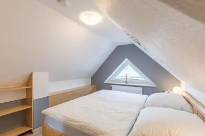 Ein Bett oder Betten in einem Zimmer der Unterkunft Haus Seewind Wohnung 2