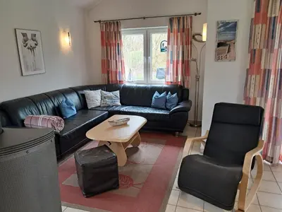 Ein Sitzbereich in der Unterkunft Ferienhaus Strandperle