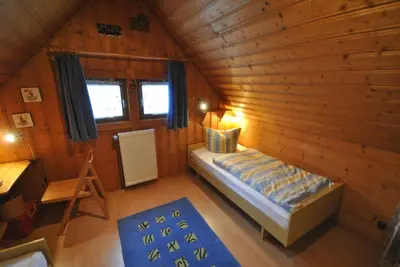 Ein Bett oder Betten in einem Zimmer der Unterkunft Ferienhaus Buddelschiff