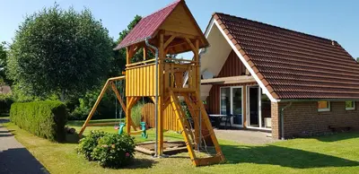 Ein Kinderspielbereich in der Unterkunft Ferienhaus Sonnentau