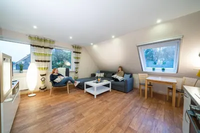 Ein Sitzbereich in der Unterkunft Ferienwohnung Kiebitz IV