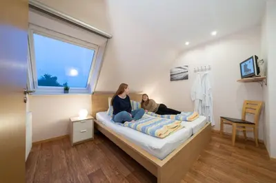 Ein Bett oder Betten in einem Zimmer der Unterkunft Ferienwohnung Kiebitz IV
