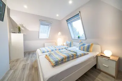 Ein Bett oder Betten in einem Zimmer der Unterkunft Ferienwohnung Kiebitz II