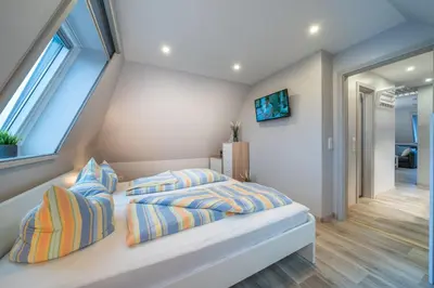 Ein Bett oder Betten in einem Zimmer der Unterkunft Ferienwohnung Kiebitz II