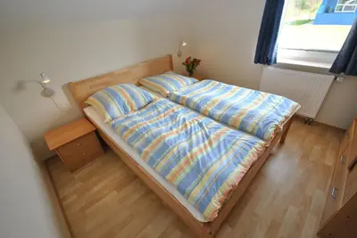 Ein Bett oder Betten in einem Zimmer der Unterkunft Ferienhaus Strandmuschel