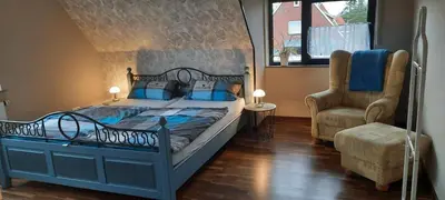 Ein Bett oder Betten in einem Zimmer der Unterkunft Ferienwohnung Schwiemann, Obergeschoss