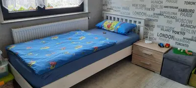 Ein Bett oder Betten in einem Zimmer der Unterkunft Ferienwohnung Schwiemann, Obergeschoss
