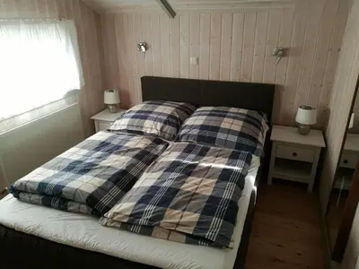 Ein Bett oder Betten in einem Zimmer der Unterkunft Ferienhaus Südsee 26