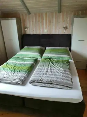 Ein Bett oder Betten in einem Zimmer der Unterkunft Ferienhaus Südsee 26