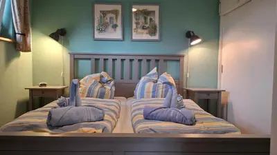 Ein Bett oder Betten in einem Zimmer der Unterkunft Ferienhaus Kormoran