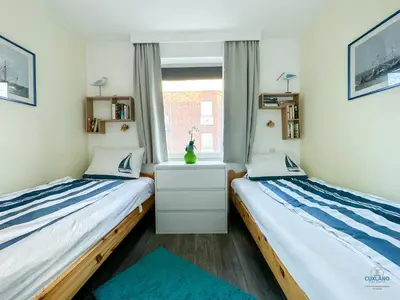 Ein Bett oder Betten in einem Zimmer der Unterkunft Residenz Thalassa Whg. 3