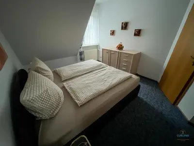Ein Bett oder Betten in einem Zimmer der Unterkunft Ferienhaus Alter Duhner Weg 7h