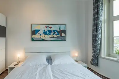 Ein Bett oder Betten in einem Zimmer der Unterkunft Am Seedeich 7, Wohnung 4