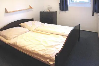 Ein Bett oder Betten in einem Zimmer der Unterkunft Wohnung in Cuxhaven mit einem gemeinsamen Pool