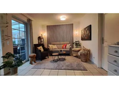 Ein Sitzbereich in der Unterkunft Ferienwohnung im EG in Friedrichskoog-Spitze