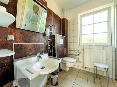 Ein Badezimmer in der Unterkunft Ferienwohnung im EG in Friedrichskoog-Spitze
