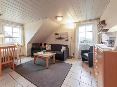 Ein Sitzbereich in der Unterkunft Ferienwohnung im OG in Friedrichkoog-Spitze