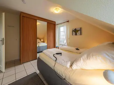 Ein Bett oder Betten in einem Zimmer der Unterkunft Ferienwohnung im OG in Friedrichkoog-Spitze