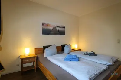 Ein Bett oder Betten in einem Zimmer der Unterkunft Landhaus Rosenhof Wohnung 2