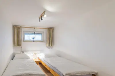 Ein Bett oder Betten in einem Zimmer der Unterkunft Vogelsand 310