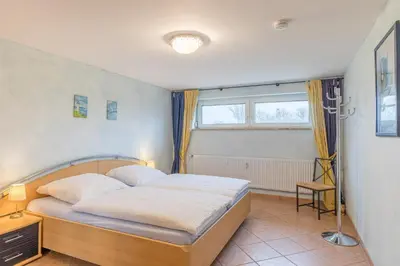 Ein Bett oder Betten in einem Zimmer der Unterkunft Vogelsand 310