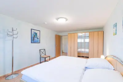 Ein Bett oder Betten in einem Zimmer der Unterkunft Vogelsand 310
