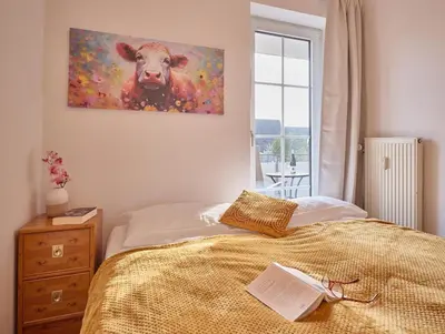 Ein Bett oder Betten in einem Zimmer der Unterkunft Robbenplate, Whng. 7
