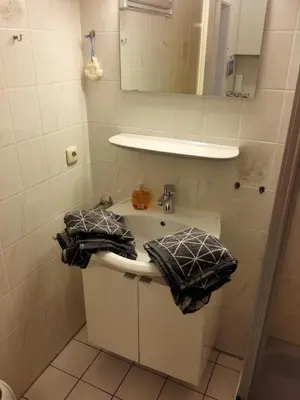 Ein Badezimmer in der Unterkunft 180° Panoramameerblick - Ferienwohnung Sandkorn