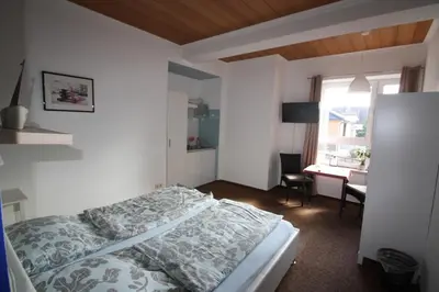 Ein Bett oder Betten in einem Zimmer der Unterkunft Armarova Ihre Ferienpension