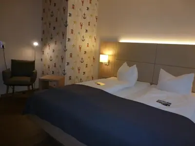 Ein Bett oder Betten in einem Zimmer der Unterkunft Hotel das Möwenstübchen