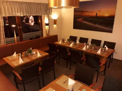 Ein Sitzbereich in der Unterkunft Hotel das Möwenstübchen