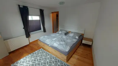 Ein Bett oder Betten in einem Zimmer der Unterkunft Ferienhaus Am Oland