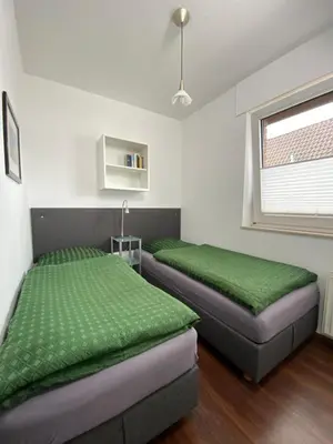 Ein Bett oder Betten in einem Zimmer der Unterkunft Ferienwohnungen Am Ahoibad