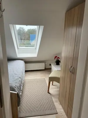 Ein Bett oder Betten in einem Zimmer der Unterkunft Strandnahe Ferienwohnungen Duhnen inkl Fahrrädern Cuxhaven