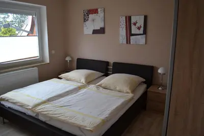 Ein Bett oder Betten in einem Zimmer der Unterkunft Strandnahe Ferienwohnungen Duhnen inkl Fahrrädern Cuxhaven